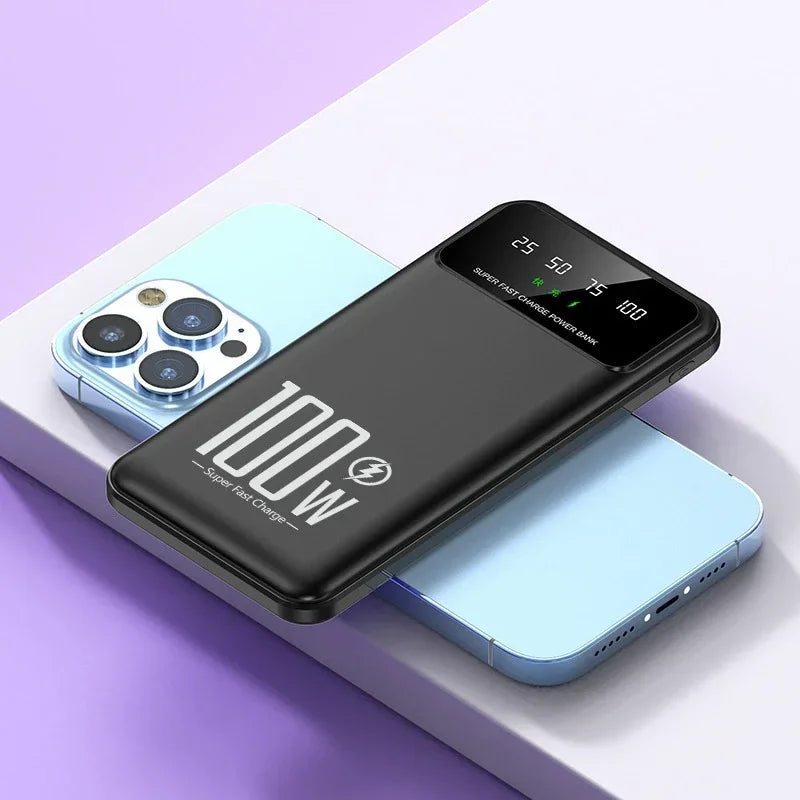 Black power bank with '100W' branding on a purple and white background